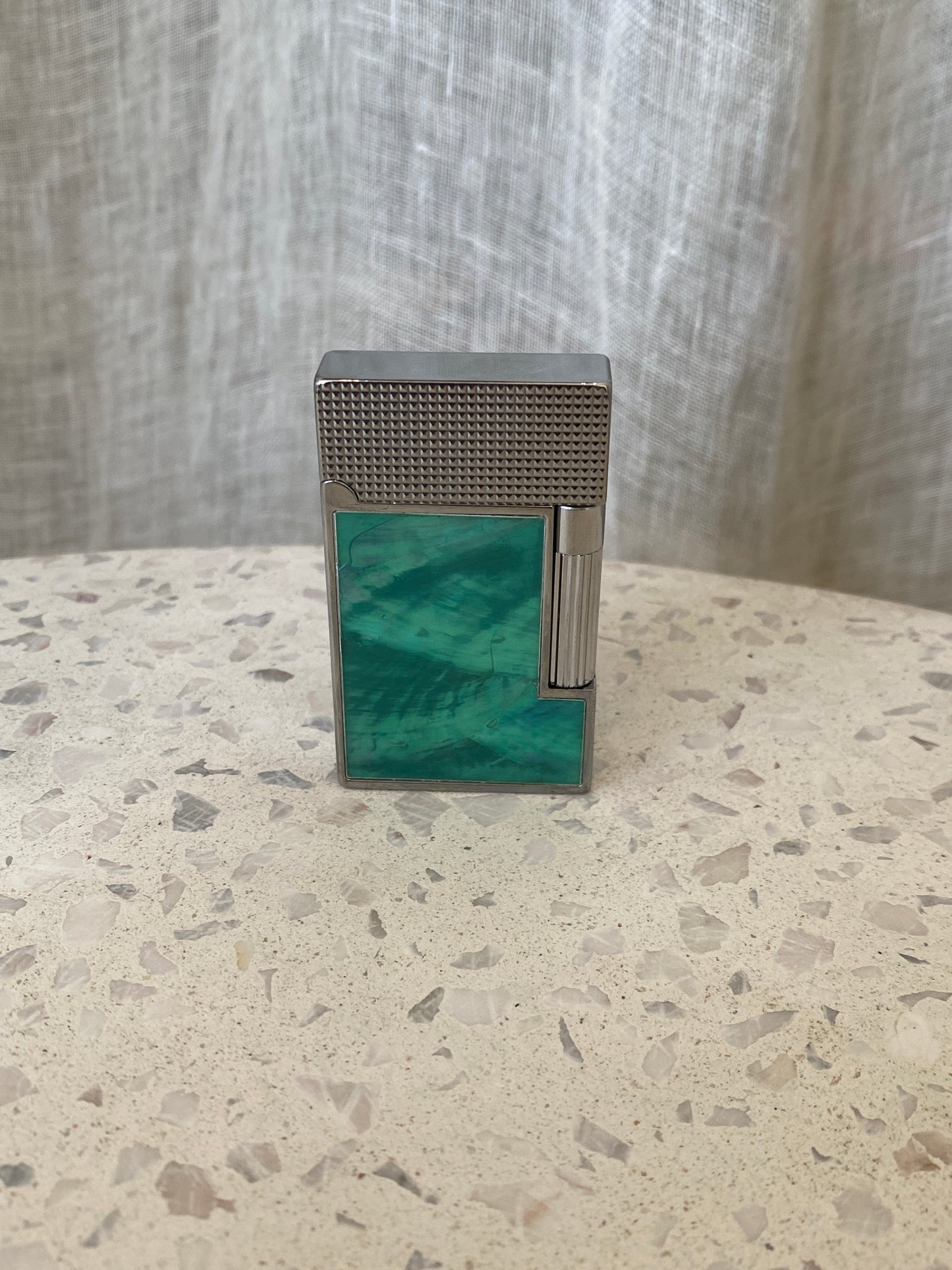 Vintage lighter with green shell