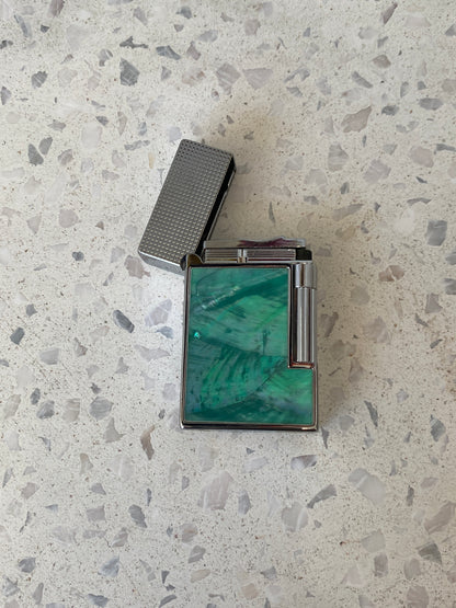 Vintage lighter with green shell