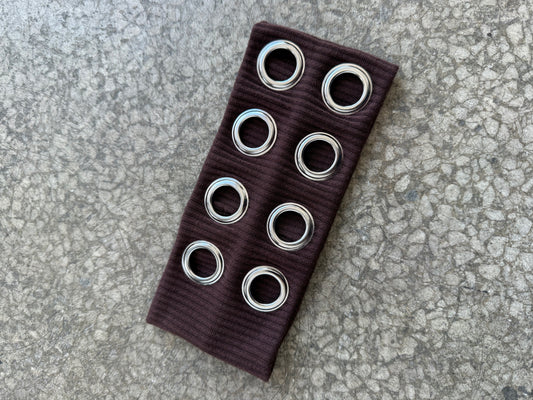 Headband with metal eyelets